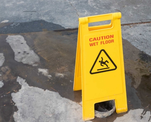 caution sign on wet concrete